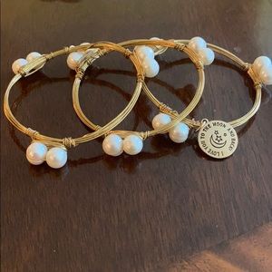 Three bangle set. Gold with pearls